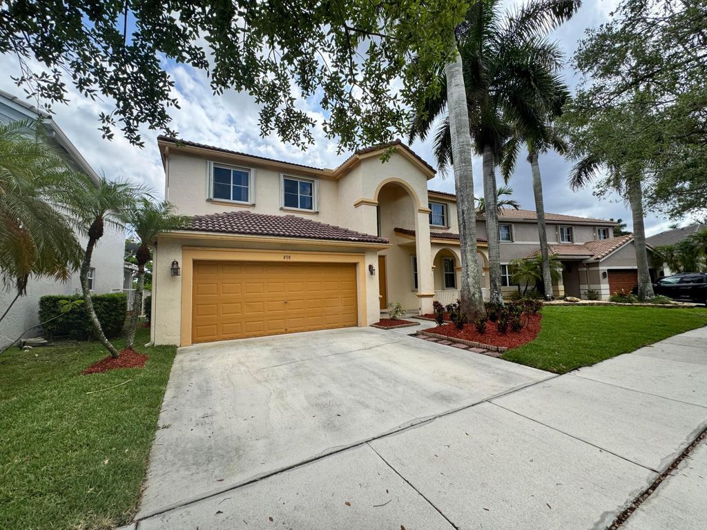 Photo of 898 Tulip Circle, Weston, FL 33327 (MLS # B26023454)
