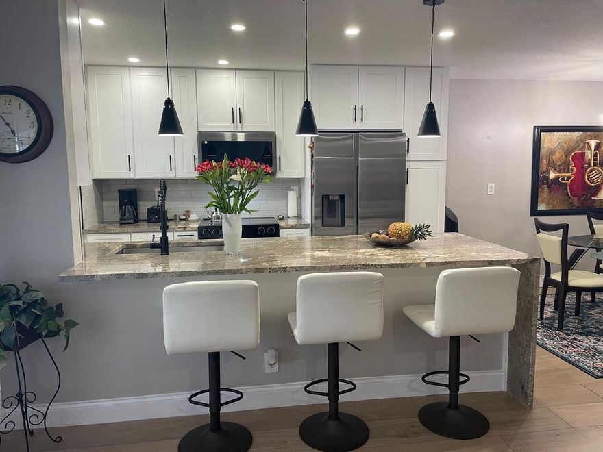 Totally renovated one story villa condo in Delray Beach,It has 1 bedroom,1.5 baths with a new walking shower & new vanity.Open concept kitchen with view to dining & living rooms, big island with granite countertop, all new kitchen cabinets with a lots of storage, including top of the line appliances, spice & garbage disposable & ice maker line in the fridge, 2 walking closets & french doors in the bedroom.New stack Washer & Dryer. No popcorn ceiling, waterproof wood laminate floors, fresh paint throughout, new water heater, new electric panel, all new light fixtures & ceiling Fans, new windows, new back door. Enclosed Sunroom/office, private back patio. Great and quiet neighbors. Monthly fees include: water, cable & high speed internet. Close to all shops and the beach.