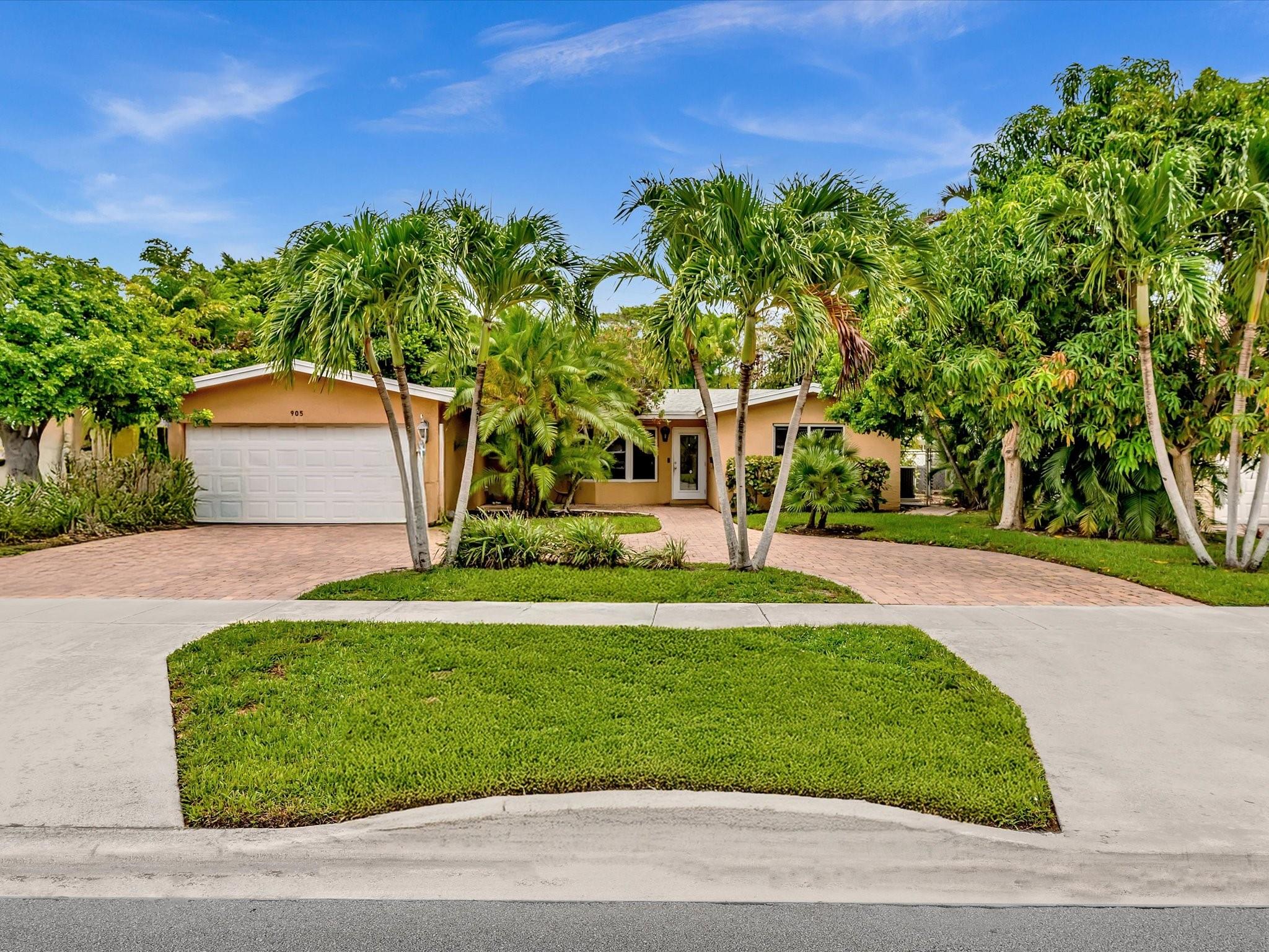 Step inside this renovated 3-bedroom, 2-bath home with a 2-car garage, located in The Cove, one of Deerfield Beach’s most desirable neighborhoods. The open split-bedroom layout features a bright kitchen with a large island, quartz counters, and stainless steel appliances, perfect for entertaining. The private primary suite includes a walk-in closet and updated bathroom. Two additional bedrooms and a renovated second bath offer space for family, guests, or a home office. The family room flows into a large fenced backyard with plenty of privacy from your neighbors and plenty of room to relax, play, or host friends. Highlights include fully renovated with impact windows and doors, a circular driveway, 2-car garage. Just one mile from the beach and close to parks, schools and waterfront dining
