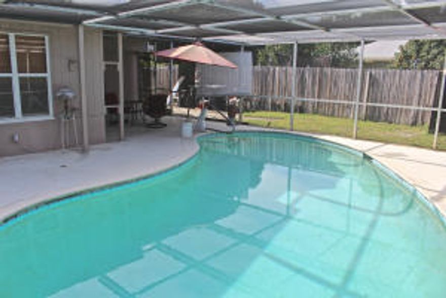 Have you been looking for a great value on a home that you can make your own? You will love this 4 bedroom home on a 1/4 acre lot. There are a lot of upgrades started for you including a large pool, granite countertops, tile floors, a newer roof, and an updated electric panel. Inside there are gorgeous, vaulted, beamed ceilings that make the living space inviting and open. The kitchen was updated only 2 years ago making this the ideal place for someone who loves to cook. This is the ideal layout with a three way split floor plan. The 4th bedroom also has great storage space. Outside The owner has installed a chain link fence with a 10' wide gate for boat storage, as well as a large circular driveway. There is great privacy with mature eureka palms out front.