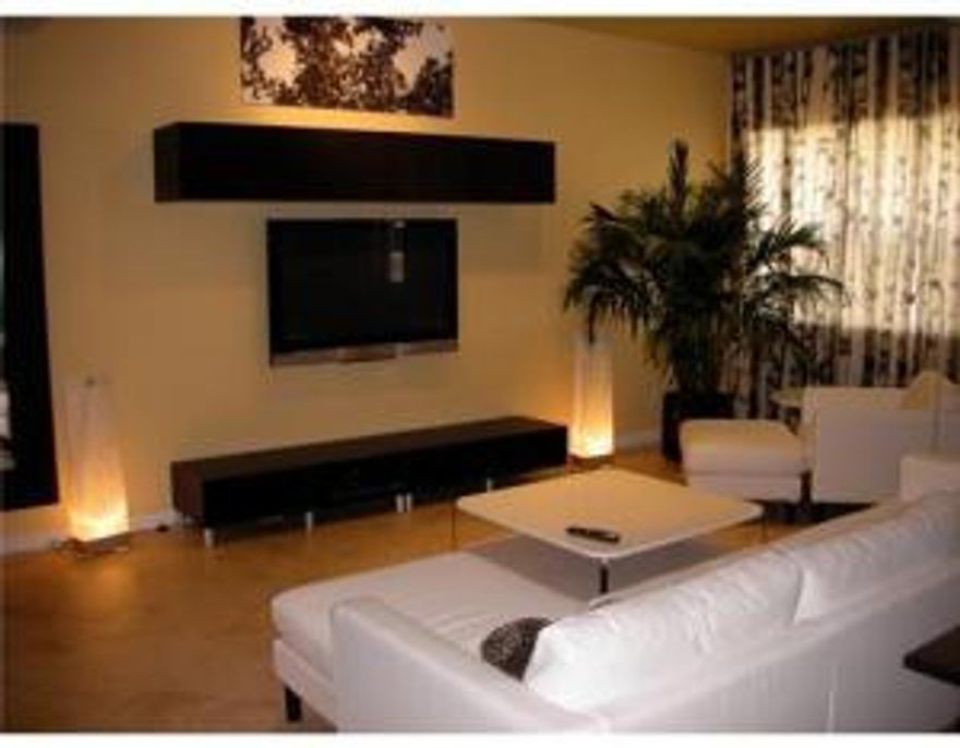 Tri-level town home no elevator. The 4th floor is the rooftop outdoor area. It has a grill, lounge chairs and a hot tub. in Tuscany style gated community. 10 minutes to the beach, Beautiful kitchen with granite.go to LIGHTHOUSEPOINTRENTAL.COM for complete photographs.