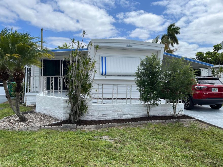 Look and the feel of a double wide. Recently remodeled kitchen with granite countertops and remodeled bathrooms. Handicap ramp on front entrance. Has a carport, front porch, 55 plus community
