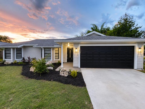 Photo of 801 SW Harvard Road, Port Saint Lucie, FL 34953 (MLS # B26054327)