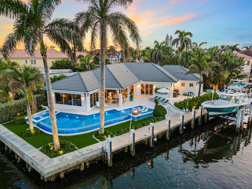 SPECTACULAR CUSTOM BUILT INTRACOASTAL POINT LOT WITH 200 FEET OF SEAWALL AND A NEW 2023 - 100 FOOT POURED CONCRETE DOCK W/ 40,000 LBS BOAT LIFT, SEAWALL RAISED 19'' TO NEW CODE. JUST MINUTES TO THE BEACH AND ATLANTIC AVENUE. THIS 3 BR 3.5 BA W/ DEN WAS BUILT WITH THE FINEST FINISHES AND MATERIALS, MARBLE FLOORS, WOOD FLOORS, CUSTOM MILLWORK THROUGHOUT, GOURMET CHEF'S KITCHEN W/ THERMADOR APPLIANCES, SUB ZERO REFRIGERATOR, WINE COOLER & ICE MAKER, A SALT WATER INFINITI EDGE POOL W/ SUN SHELF AND SPA, W/ FIRE WATER FEATURE, ALL POOL EQUIPMENT WAS INSTALLED IN 2023/24 (POOL HEATER, CHILLER, FILTERS), SUMMER KITCHEN. NEW MARBLE PATIO DECK & POOL TILE, BUILT IN PATIO CEILING DROP DOWN 60 INCH TV, WHOLE HOUSE CRESTRON SURROUND SOUND SYSTEM, NEW 2024 GENERATOR, COFFERED CEILING IN FAMILY ROOM W/