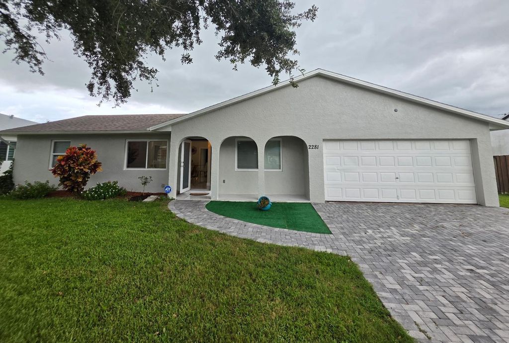 Photo of 2281 SE Belvedere Street, Port Saint Lucie, FL 34984 (MLS # B26006441)