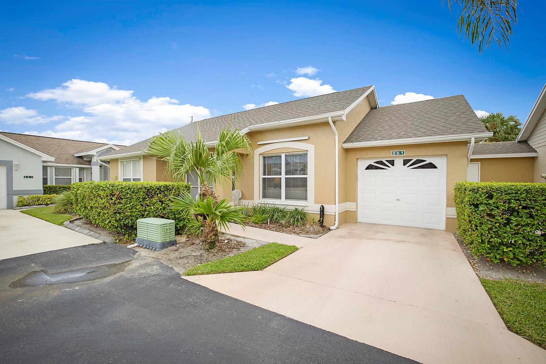 Beautifully maintained 2-bed, 2-bath villa in the desirable 55+ Kings Isle community. This inviting home features a brand-new roof for lasting peace of mind. Inside, vaulted ceilings, tile flooring, and a bright open layout create an airy feel. The kitchen offers generous cabinet space and natural light from large windows. A cozy dining area flows into the screened lanai—perfect for morning coffee or entertaining. The spacious primary suite boasts a walk-in closet and en-suite bath with step-in shower. A versatile second bedroom and full guest bath provide space for family, hobbies, or an office. Just steps from Kings Isle’s resort-style amenities, this villa blends comfort, convenience, and lifestyle in one perfect package.