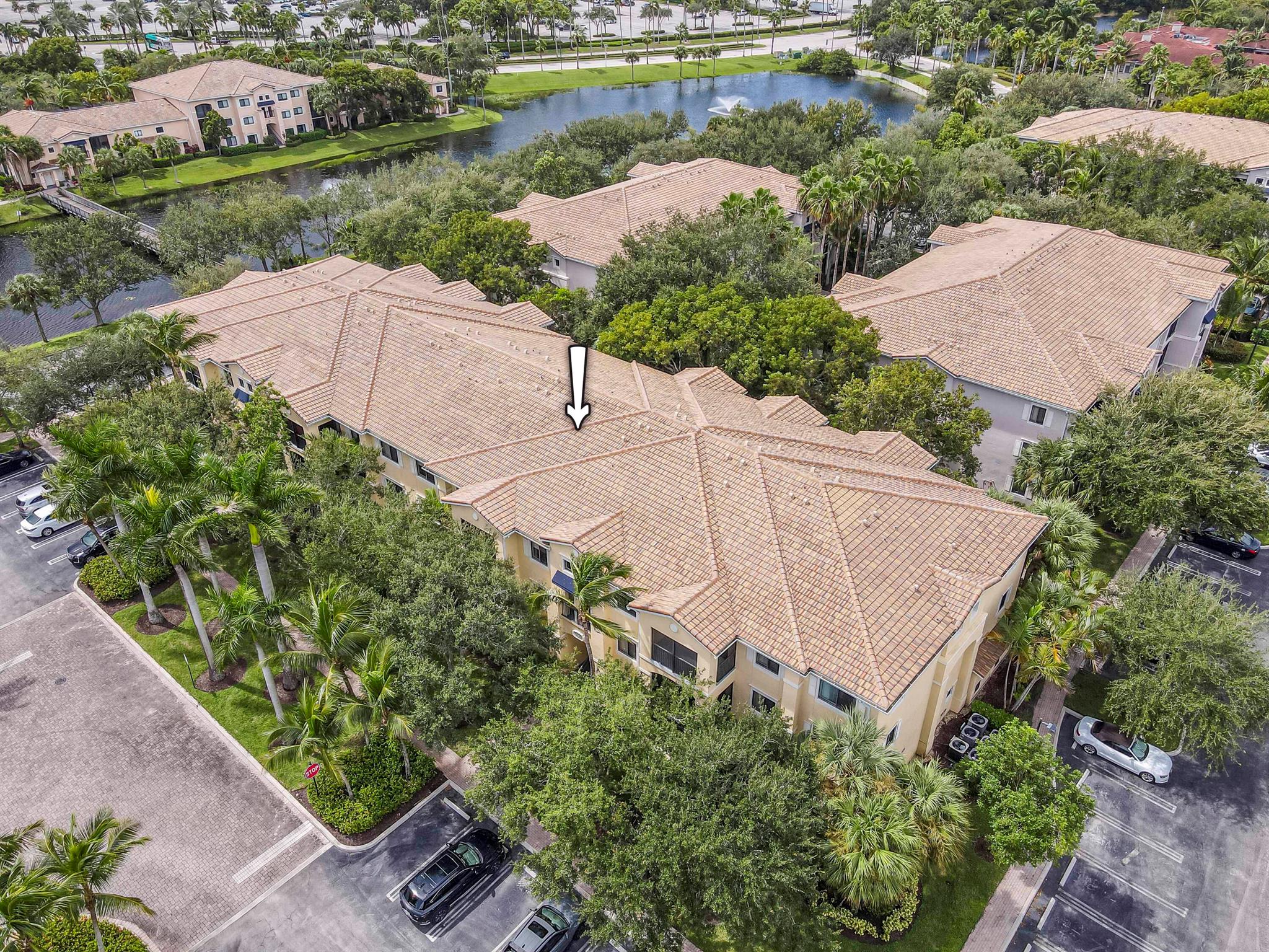 Spacious 3-bedroom, 2-bath, 1st-floor condo in the private gated community of San Matera. Enjoy a functional kitchen with newer 2022 Smudge-Proof Black Stainless Steel appliances, and beautiful bamboo wood and tile flooring throughout, no carpet! Features include impact windows/doors and a new 2025 A/C. Step onto the screened-in lanai, your personal oasis for morning coffee, evening cocktails, or unwinding with a good book while enjoying fresh air and serenity. San Matera offers resort-style amenities: pool, jacuzzi, fitness center, racquetball, pickleball, tennis, billiards, sauna, and a conference room with Wi-Fi. Minutes to I-95, Turnpike, Downtown at the Gardens, the Gardens Mall, dining, and shopping. Don't miss this opportunity!