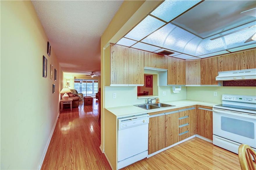 55+GLASS ENCLOSED PATIO WITH WATER VIEW*A/C REPLACED 2015*WATER HEATER 2007*FURNITURE LEFT FOR SELLERS CONVENIENCE*LOW MONTHLY MAINTENANCE* GOOD INCOME AND CREDIT REQUIRED BY ASSOCIATION-YEAR BUILT 1981 (NO LEAD DISCLOSURE REQUIRED)