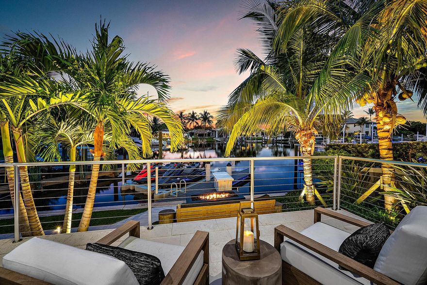 Completed in the latter part of 2021, this magnificent single-story tropical waterfront sanctuary combines chic contemporary design, soaring ceilings, and an impressive open floor plan. No detail has been left to chance, as the residence showcases impeccable craftsmanship, premium materials and exquisite designer finishes throughout.

The expansive, state-of-the-art chef's kitchen is equipped with high-end Thermador appliances, including a gas cooktop, dual dishwashers, double ovens, two beverage drawers, a spacious pantry, and an abundance of storage space. Equipped with a Savant smart home system, luxurious lighting fixtures and chandeliers, inviting fireplaces, custom drapes, motorized blinds, California closets throughout, a well-appointed wet bar and an elegant formal dining room complete with wine walls and storage. Adding to the feeling of opulence are Armani silk wall coverings gracing the family room and living room. In addition, the property boasts a comprehensive whole-house scenting system, a sophisticated security camera setup, an integrated sound system throughout and a 3-car garage with built-in storage, slat walls, and epoxy flooring.

All major living spaces seamlessly connect to an exquisite private backyard oasis featuring a large covered loggia with phantom screens, a heated saltwater pool and spa, an outdoor kitchen for summer delights, a refreshing outdoor shower, multiple inviting sitting areas, lush tropical landscaping, gorgeous sunsets and artfully designed lighting to enhance the ambiance.

The dock is outfitted with full-electric and will accommodate up to a  35-foot vessel. Nestled along a wide canal without obstructions, it provides swift passage to the Intracoastal waterway, Peanut Island, the Palm Beach Inlet, and the Atlantic Ocean - a boater's dream.

Conveniently located in the Village of North Palm Beach only minutes from shopping, fine dining, North Palm Beach Country Club, major highways, Palm Beach International airport and some of the area's best beaches. 

DISCLAIMER: Information published or otherwise provided by the listing company and its representatives including but not limited to prices, measurements, square footages, lot sizes, calculations, statistics, and videos are deemed reliable but are not guaranteed and are subject to errors, omissions or changes without notice. All such information should be independently verified by any prospective purchaser or seller. Parties should perform their own due diligence to verify such information prior to a sale or listing. Listing company expressly disclaims any warranty or representation regarding such information. Prices published are either list price, sold price, and/or last asking price. The listing company participates in the Multiple Listing Service and IDX. The properties published as listed and sold are not necessarily exclusive to listing company and may be listed or have sold with other members of the Multiple Listing Service. Transactions where listing company represented both buyers and sellers are calculated as two sales. Cooperating brokers are advised that in the event of a Buyer default, no financial fee will be paid to a cooperating Broker on the Deposits retained by the Seller. No financial fee will be paid to any cooperating broker until title passes or upon actual commencement of a lease. Some affiliations may not be applicable to certain geographic areas. If your property is currently listed with another broker, please disregard any solicitation for services. Copyright 2024 by the listing company. All Rights Reserved.