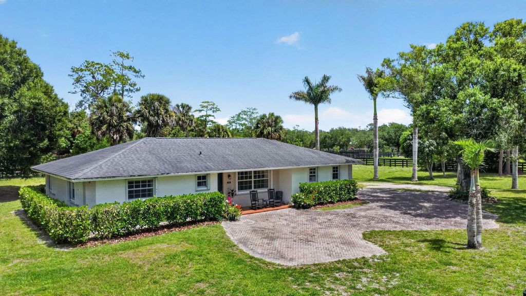 Photo of 14964 Snail Trail, Loxahatchee Groves, FL 33470 (MLS # B26022091)