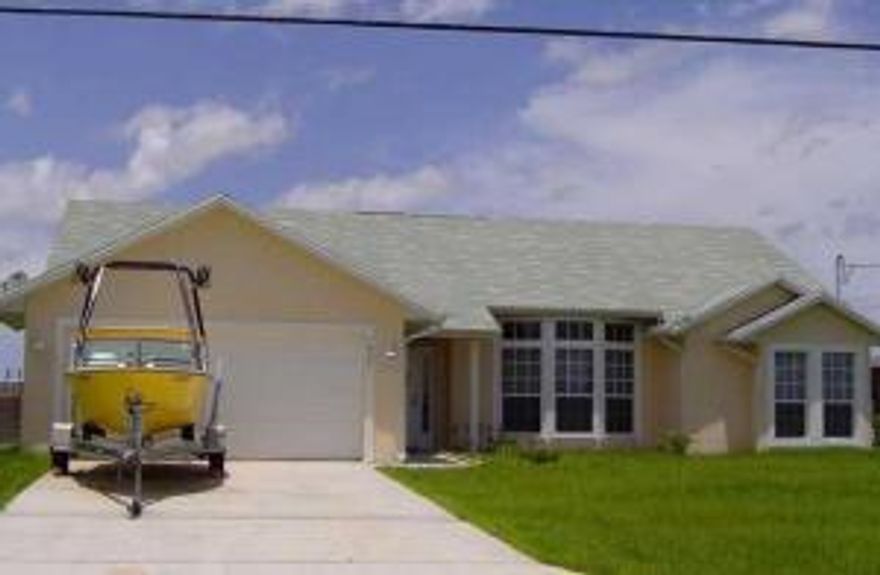 Awesome C-24 Canal Waterfront ''CBS'' Construction..... HomeLots of Tile Floors, Beautiful Kitchen with Stainless Steel Appliances, Formal Living and Family Rooms, Eat in Kitchen and Formal Dining Room, this home won't last at this price...