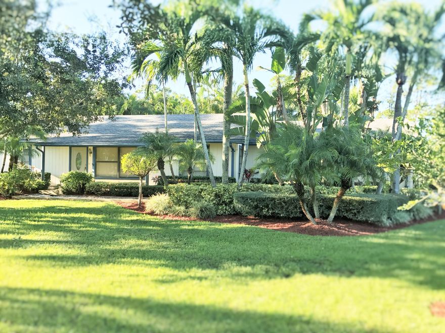 Beautiful home in the Farms ! Updated Kitchen, granite, and cabinets newer appliances stainless steel.  Bathrooms are updated , tiled floors throughout, carpet in MB.  Oversized 2 car garage, A/C newer about 7-8 years.
25x12 detached shop. Nicely lushly tropical landscaping everywhere.  Tropical paradise!