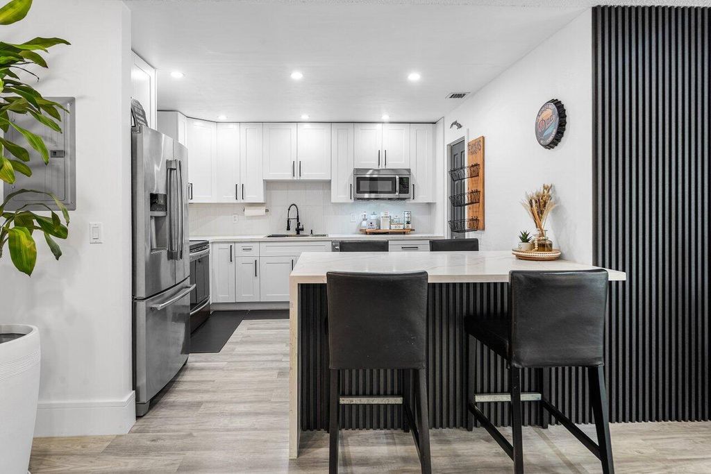 Photo of 8014 Ambach Way, Hypoluxo, FL 33462 (MLS # B26017078)