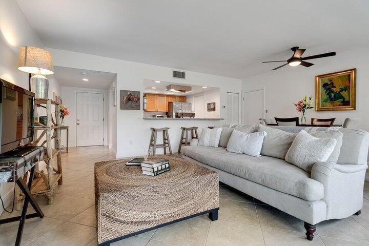 This beautifully maintained and move in ready first floor 1 bedroom 1 bath fully furnished residence is located in the highly desirable Tennis Lodges within Palm Beach Polo Club. The home offers a full kitchen appointed with stainless steel appliances and tile throughout the unit. The spacious primary suite includes a walk in closet and sliding glass doors that open to a spacious covered patio, perfect for relaxing outdoors. Enjoy a prime location within Wellington plus convenient parking and guest parking just steps away. Residents benefit from a gated community with 24 hour security patrols, beautiful walking trail and restaurants within walking distance.This unit is available for seasonal, off season or