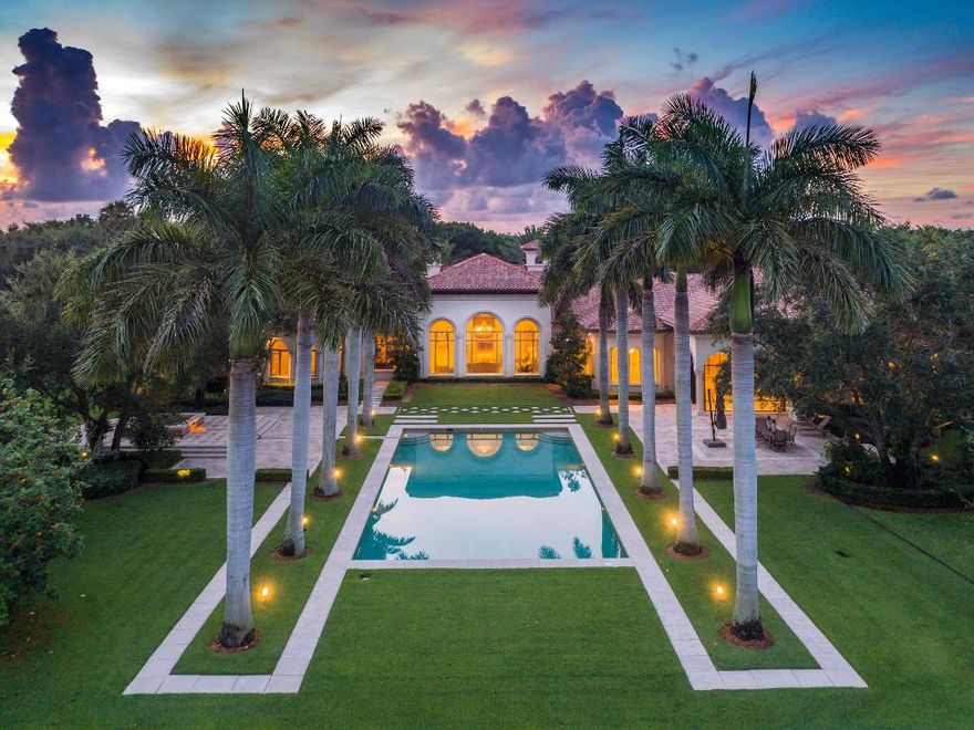 Magnificent custom built estate on over five exquisitely landscaped acres, the largest lakefront lot in exclusive private enclave of Stone Creek Ranch. 
Over 10,650 sqft under air, Chefs Gourmet Kitchen, 7 Bedrooms, 10.5 Bathroom, Billiard's Room with Bar,7 Car AC Garage. Olympic size pool with spa/tub surrounded by 150 foot tall Royal Palms. Huge Outdoor Covered Lanai.
Beach Volley Ball Court. 
The interior recently updated and elegant master suite redesigned by one of the top luxury interior designers in South Florida.    
Centrally located between Delray’s White Sandy Beaches, Wellington Polo Grounds, Top Restaurants on famous Atlantic Ave, Private FBO in Boca Raton, PBI International Airport, and world renowned Worth Ave. Property can be divided for investment opportunity.