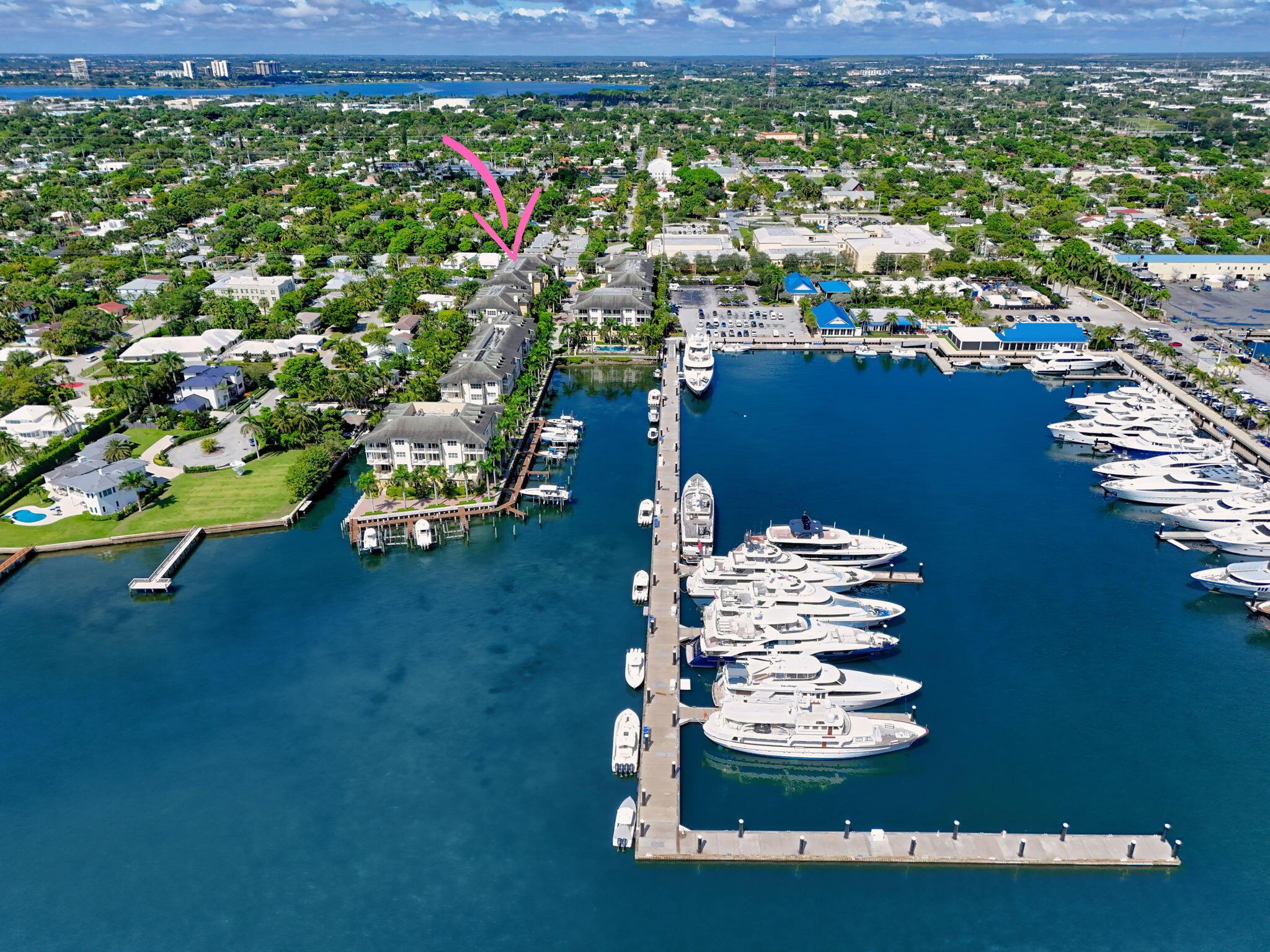 Bring only your clothes and start enjoying the best of the Florida lifestyle. This residence is available fully furnished for seasonal or annual lease, or unfurnished for annual terms. Nestled in a boutique waterfront community beside the prestigious Rybovich Superyacht Marina and just steps from the Intracoastal, this fourth-floor penthouse combines elegance with convenience. Private elevator entry, soaring ceilings, and an open-concept layout flow seamlessly to balconies off both the living area and primary suite. Each bedroom includes its own ensuite bath, offering comfort and privacy for residents and guests alike. Two garage spaces, secure gated access, and the option to lease boat slips (when available) further elevate the appeal of this exclusive property. Perfectly positioned near