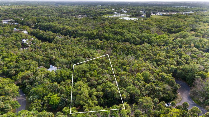 Discover the charm of Old Florida living on this beautiful .57-acre homesite nestled in a truly unique, natural setting. Surrounded by lush native landscape and just moments from the North Fork of the St. Lucie River, this property offers a rare opportunity to build your dream home in a serene, private oasis. Homes in the area are thoughtfully constructed on pilings, enhancing harmony with the environment. Embrace the tranquility, wildlife, and timeless beauty that make this location so special—your Florida paradise awaits.