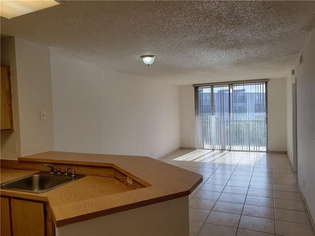 Photo of 8750 N Sherman Circle N #406, Miramar, FL 33025 (MLS # B26025543)