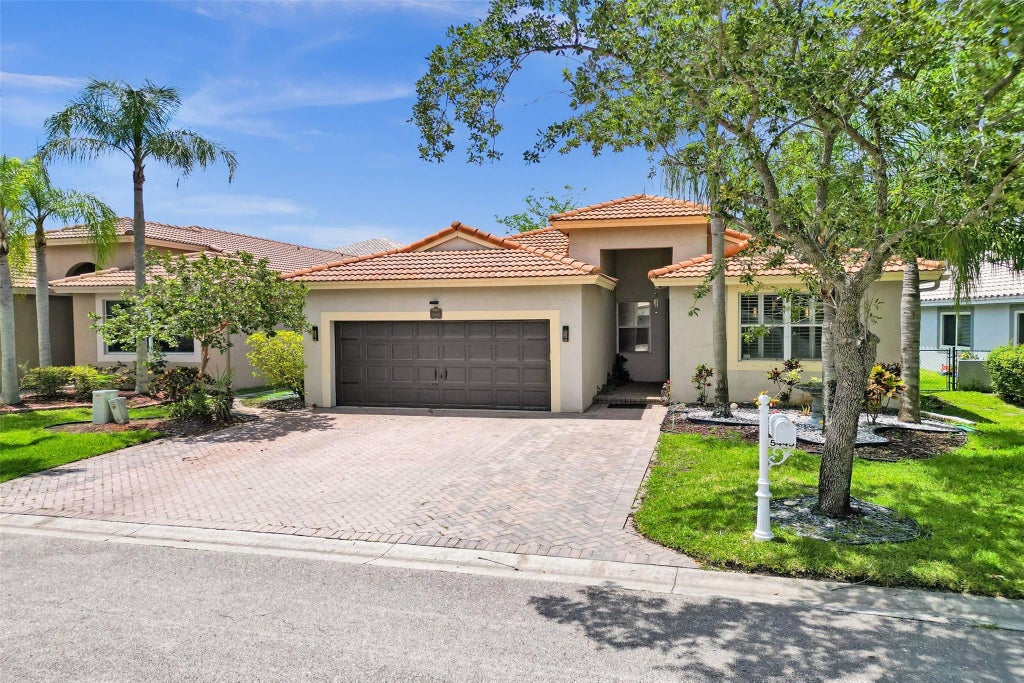 Photo of 5445 NW 122 Drive, Coral Springs, FL 33076 (MLS # F10506915)