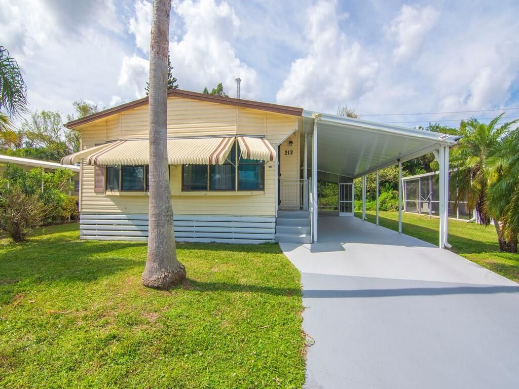 Photo of 212 W Caribbean, Port Saint Lucie, FL 34952 (MLS # R11112359)