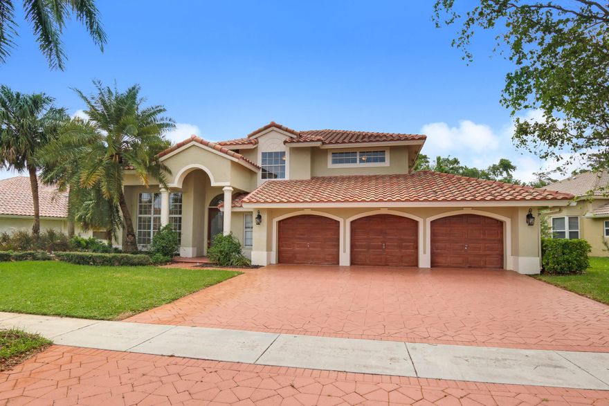 Beautifully renovated Scottsdale model in Boca Isles North. This home features 24x24 polished marble floors through out the first level of the home, a high end custom kitchen with Thermador appliances, tumbled marble backsplash, and an island with wine cooler. There is one bedroom and one bathroom downstairs, along with a large laundry room. Upstairs features 4 bedrooms and 2 designer bathrooms. Enjoy your private backyard backing to a lush tropical preserve. The pool has been redone and a new pool pump was recently installed as well. Roof was just preplaced as well as the main AC unit in 2016!