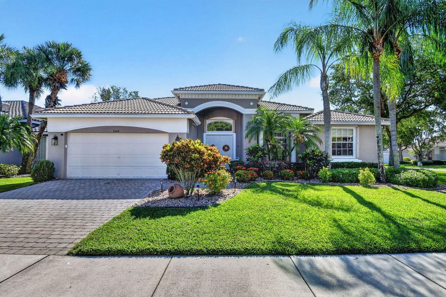 Welcome home to the largest square ft. floor plan in Bellagio!!! This spacious 4 Bedroom, 2 ½ bath Veranda Model sits on a corner lot with a partial lake view.  The standard rear outdoor patio has been completely re-imagined with a much larger footprint - high end pavers, a completely newer screened in area with additional square footage as well as a covered roof structure, additional lighting, additional electrical outlets as well as a 70 Sq ft fence. A truly unique outdoor oasis to take full advantage of the partial lake view and the ultimate in outdoor living! The wow factor starts with the beautiful professionally landscaped front with river rocks, new lighting and even a ring doorbell.  As you enter your 2500+ sq ft home you are immediately flooded with natural light, soaring ceilings and a beautiful neutral color palate.   Ceiling fans and lighting have been updated and upgraded.  New garage motor, springs, remotes with WIFI capability.  New dishwasher, central vacuum system, ADT alarm system, pull down attic stairs for easy and safe access to your attic for storage, additional high hats added throughout, hurricane shutters, and even a utility sink in laundry room.  Master bathroom has been beautifully updated and the primary bathroom has been completely renovated to include stunning tile work, walk in shower and glass shower door.  Master bedroom has 2 huge walk in closets plenty of room for everything! Kitchen features beautiful granite counter tops and opens into the den for effortless entertaining. HOA includes lawn care, roof cleaning, cable, Internet, 24 hour man gated security, resort-style amenities. Amenities include 10 Har-Tru tennis & pickleball ( 5 lighted for night play) , bocce, indoor/outdoor pools, fitness center, bistro café ( serving breakfast and lunch) . There is a grand ballroom featuring Top-notch entertainment and events with a full-time "Lifestyle" director. There are also dozens of clubs, activities, card rooms and billiard room, arts & craft center and much more... This expansive home offers an exceptional opportunity to live life to its finest in Bellaggio!