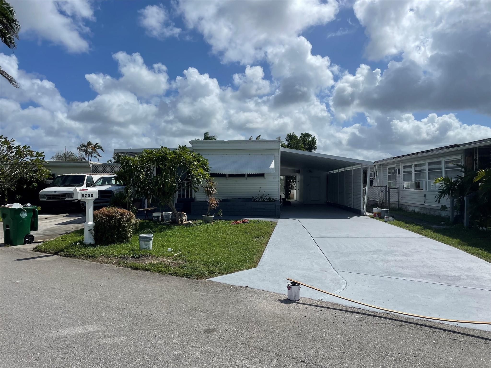 Absolutely gorgeous 3/2 double wide with huge carport - shed - newer appliances just put in - beautiful wood laminate and tile floors through out - freshly painted in and out - washer and dryer inside oversized master bathroom - -assoc. states it is HOPA verified - -priced right for quick sale - *******Owner financing available with nice down payment*********