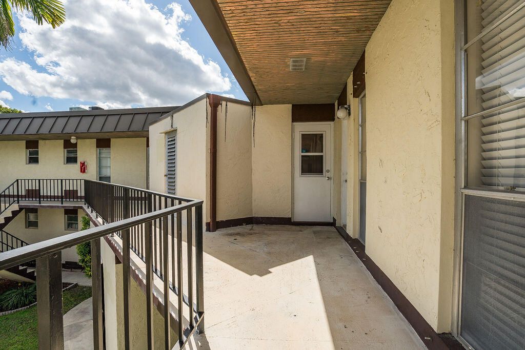 Photo of 2 Greenway Vlg N #210, Royal Palm Beach, FL 33411 (MLS # B26009638)