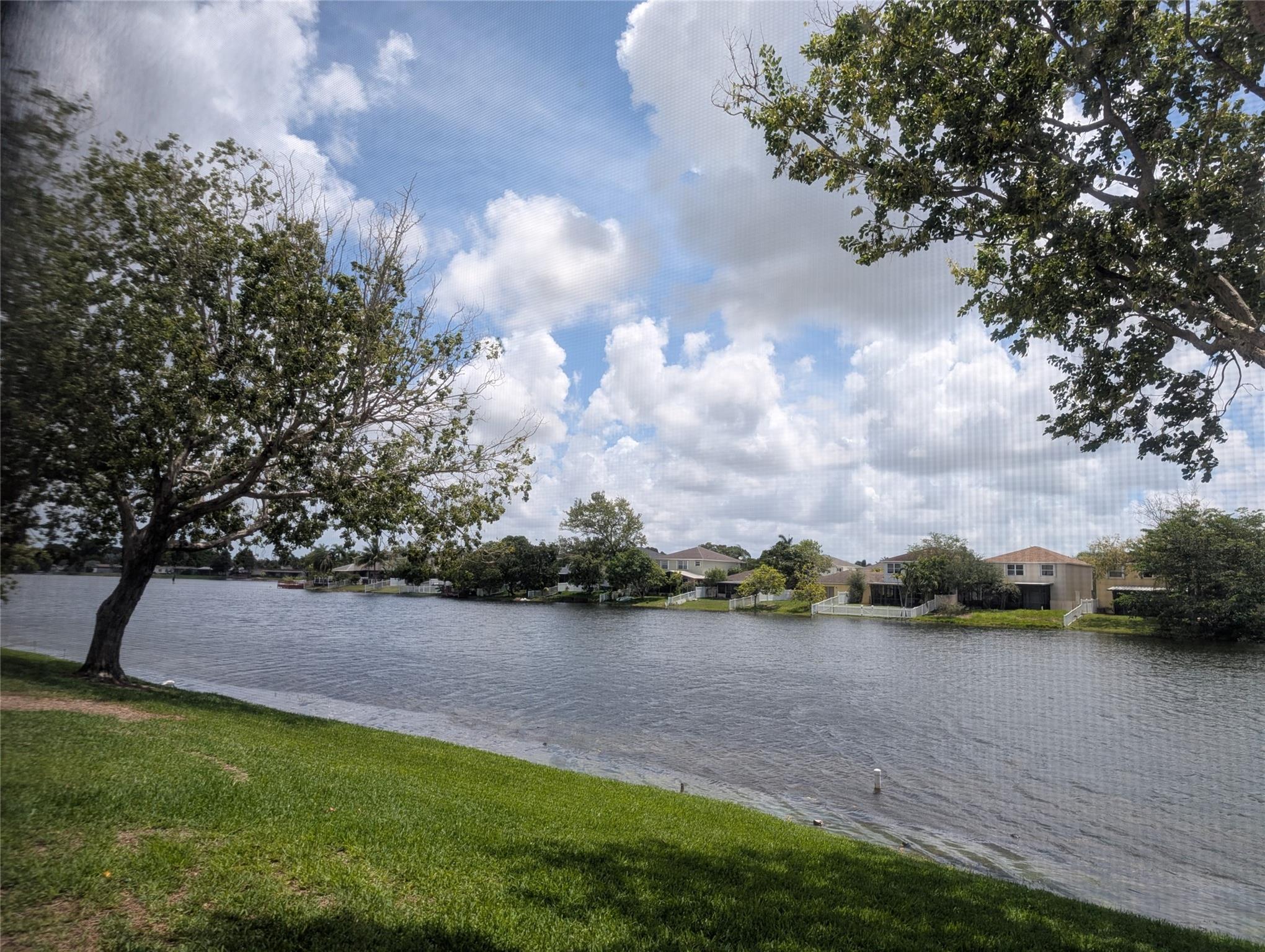 LIGHT, BRIGHT & PRIVATE 2 BEDROOM 2 BATH TOWNHOME ON THE BEAUTIFUL LAKE IN FLAMINGO VILLAS! *** ENJOY THE PEACEFUL VIEW ON THE PRIVATE SCREENED PATIO! ***TILED 1ST FLOOR! ***FRESHLY PAINTED! 1 BEDROOM AND 1 FULL BATHROOM DOWNSTAIRS, MASTER SUITE UPSTAIRS! ***NEW REFRIGERATOR AND WASHER & DRYER! *** GUARD GATED COMMUNITY COMPLETE WITH TENNIS/PICKLEBALL, 2 POOLS, RACKETBALL, ON SITE GYM AND MORE! GREAT LOCATION.... ACROSS FROM CB SMITH PARK, MEMORIAL HOSPITAL AND THE PEMBROKE LAKES MALL! THE TOWNHOME IS VACANT AND READY FOR A QUICK OCCUPANCY!