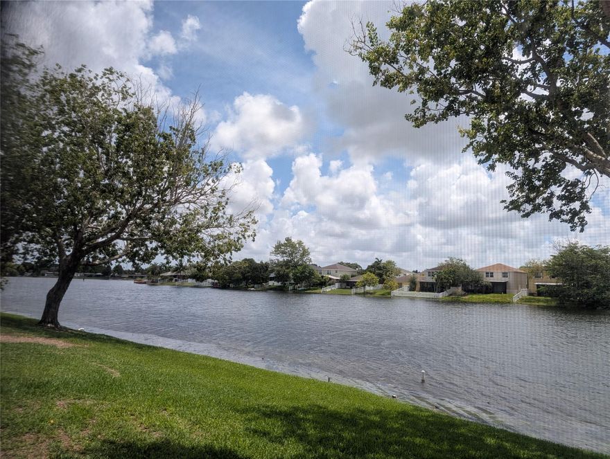 LIGHT, BRIGHT & PRIVATE 2 BEDROOM 2 BATH TOWNHOME ON THE BEAUTIFUL LAKE IN FLAMINGO VILLAS!  *** ENJOY THE PEACEFUL VIEW ON THE PRIVATE SCREENED PATIO!  ***TILED 1ST FLOOR!  ***FRESHLY PAINTED! 1 BEDROOM AND 1 FULL BATHROOM DOWNSTAIRS, MASTER SUITE UPSTAIRS!  ***NEW REFRIGERATOR AND WASHER & DRYER!  *** GUARD GATED COMMUNITY COMPLETE WITH TENNIS/PICKLEBALL, 2 POOLS, RACKETBALL, ON SITE GYM AND MORE! GREAT LOCATION.... ACROSS FROM CB SMITH PARK, MEMORIAL HOSPITAL AND THE PEMBROKE LAKES MALL! THE TOWNHOME IS VACANT AND READY FOR A QUICK OCCUPANCY!