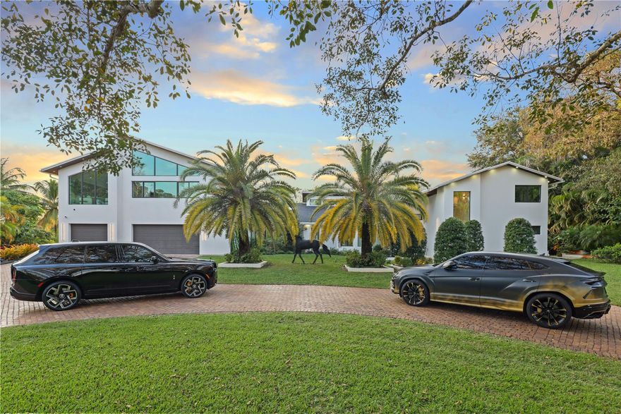 Welcome to your own privately gated millionaire’s compound. You won’t find another Parkland home with 1.25 acres like this anywhere! More than 1.5 million in finishes and remodeling. This is truly an entertainer’s paradise with a resort-style backyard, a custom patio bar that rivals high-end restaurants, plus multiple seating areas. The saltwater pool features a full glass surface. Inside offers a chef’s kitchen with onyx counters, a triple-split floor plan, and a jaw-dropping 1,400 sq ft primary suite. Spa-style baths, an oversized storage garage, $250,000+ in landscaping, and the list goes on and on.