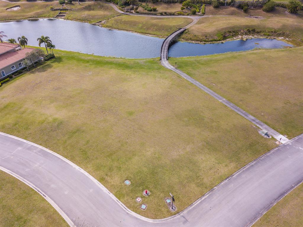 Vacant lot within the private gated exclusive community of Teoro. Beautiful cleared lot with lovely golf course view. Nice size .31 acres with no fill needed. Requires 3,000 square foot minimum house to be built.. Club membership is not required but available. Close to Florida Turnpike-shopping and dining.