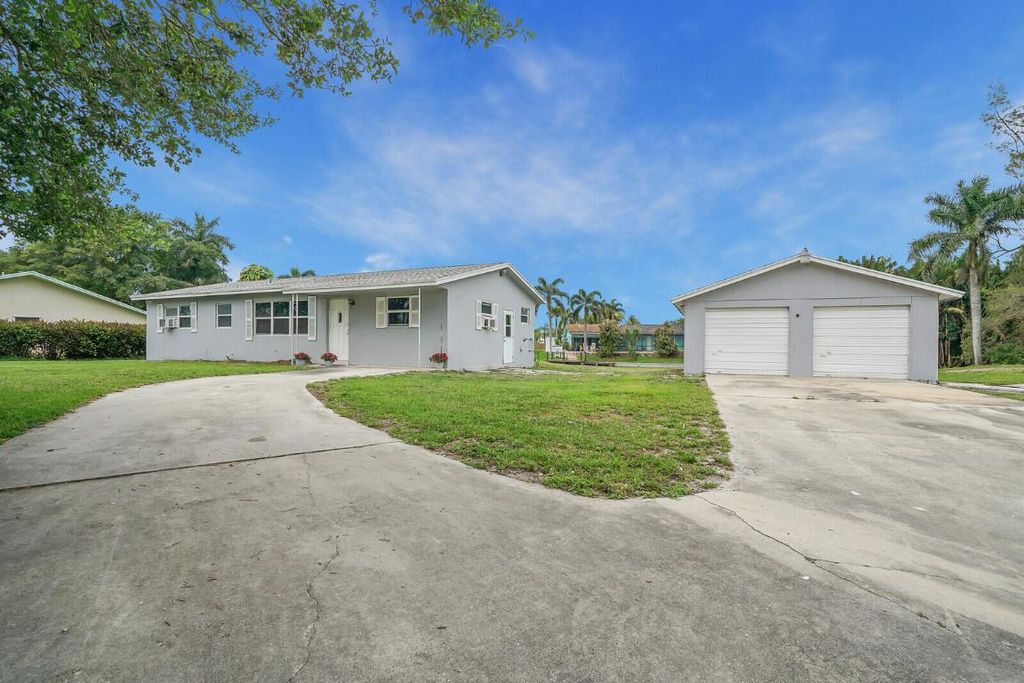 Photo of 3230 Buccaneer Road, Lake Worth, FL 33462 (MLS # R10970450)