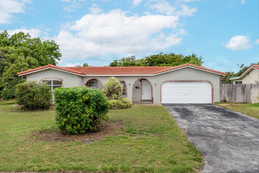 Beautifully updated, four bedroom, two bathroom, pool home in the Dells of Coral Springs.  Property features an updated kitchen with granite counter-tops and stainless steel appliances, two updated bathrooms, laminate wood flooring throughout the main living areas,   Property includes a large, two car garage, bonus den area and Florida room that is under air.  Step outside to your private oasis backyard featuring a fully fenced backyard, on the canal and private swimming pool.  Schedule your private tour today!  Roof 2008 A/C 2014