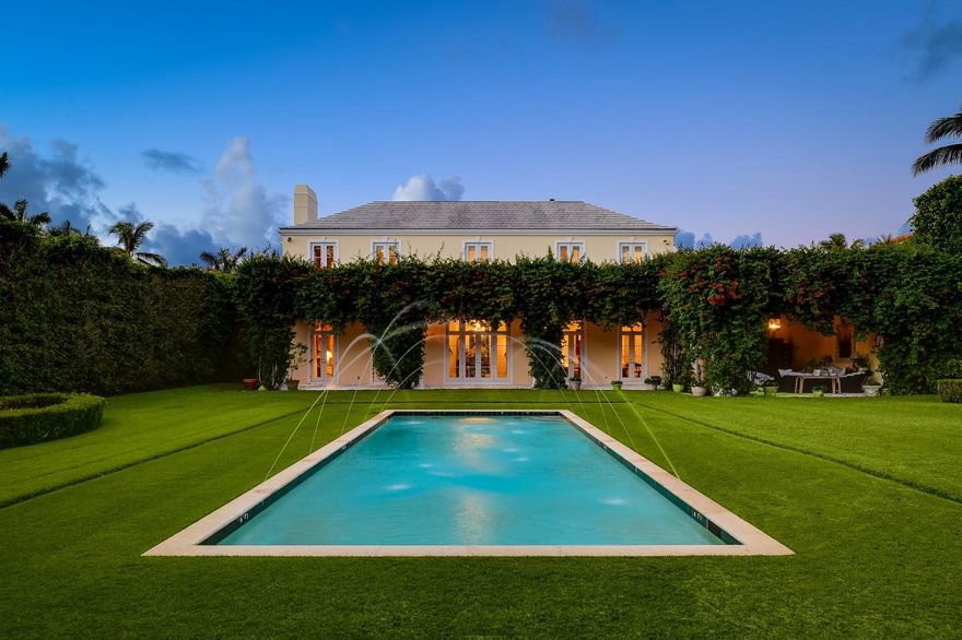 Beautiful 6BR/6.3BA Neoclassical estate on premier 125’ by 255’ +/- lot. Built in 2000, this elegant home offers a spacious layout with expansive living and family rooms, high ceilings, paneled library with fireplace, and elevator. Extensive second floor master suite with sitting room, balcony, and dual baths. Gorgeous columned loggia overlooking backyard and pool.