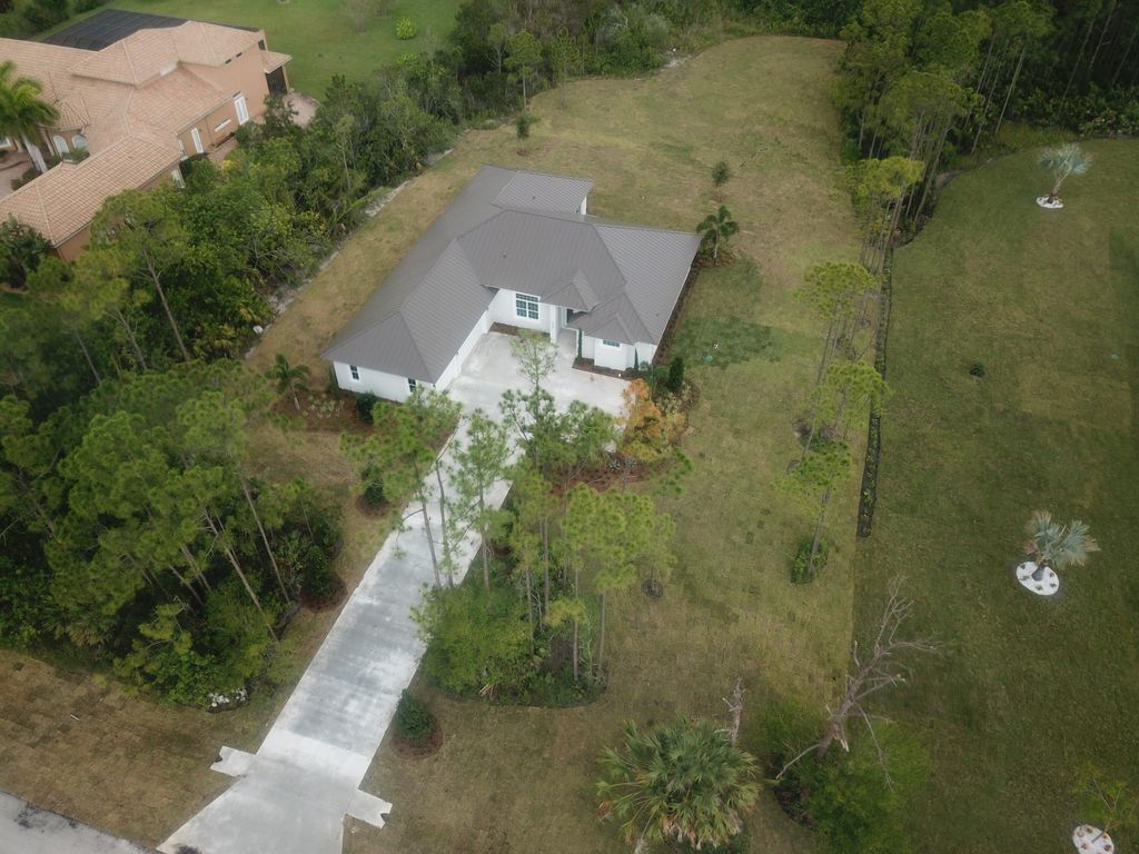 Photo of 8036 Spendthrift Lane Ln, Saint Lucie West, FL 34986 (MLS # R10817174)