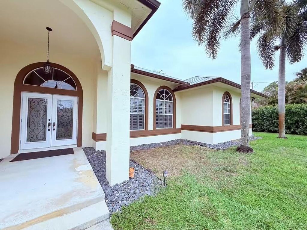 Photo of 13383 Temple Boulevard, West Palm Beach, FL 33412 (MLS # B26017657)
