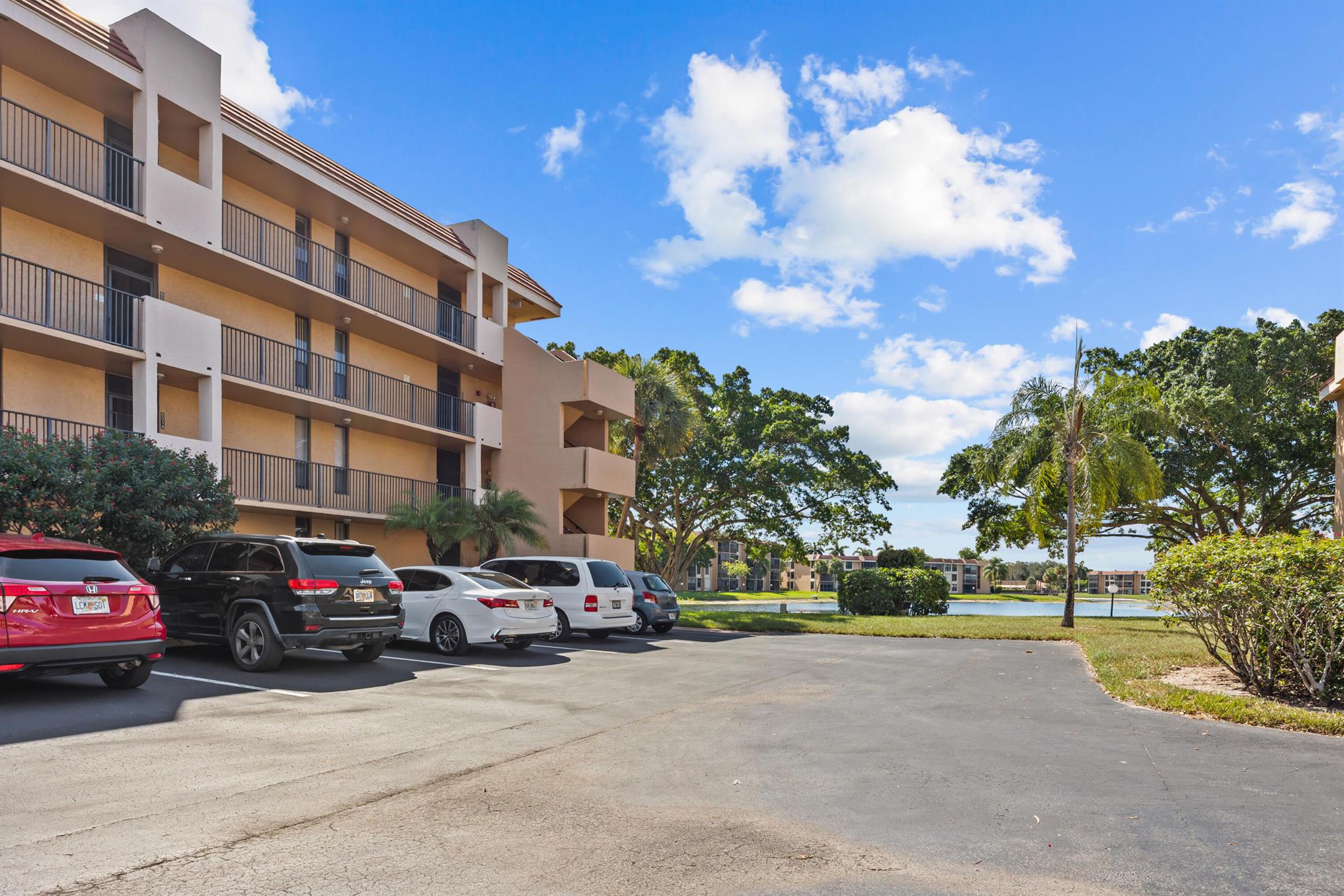 Light and bright 2 bedroom, 2 bath condo in the highly sought-after 55+ community of Coral Gate. This beautifully maintained home is filled with natural light from its many windows and offers stunning lake views from multiple areas, including the open kitchen overlooking the living room and the screened-in patio. Perfect for relaxing or entertaining! Features include a brand-new 2024 A/C, in-unit stackable washer and dryer, and a spacious floor plan. Coral Gate provides unbeatable amenities such as a pool, pickleball, clubhouse, and elevator for convenience. The affordable maintenance includes cable TV, water, trash, exterior insurance, common areas, and much more. Conveniently located near shopping, dining, and highways, this condo is truly a must-see and priced to sell