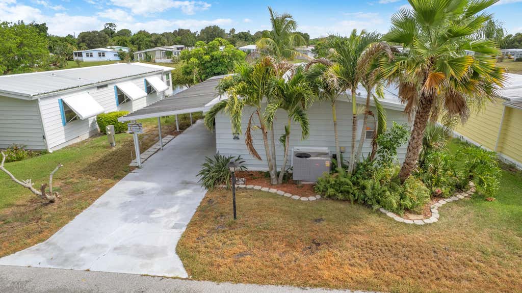 Photo of 360 NE Jade Circle, Jensen Beach, FL 34957 (MLS # B26067887)