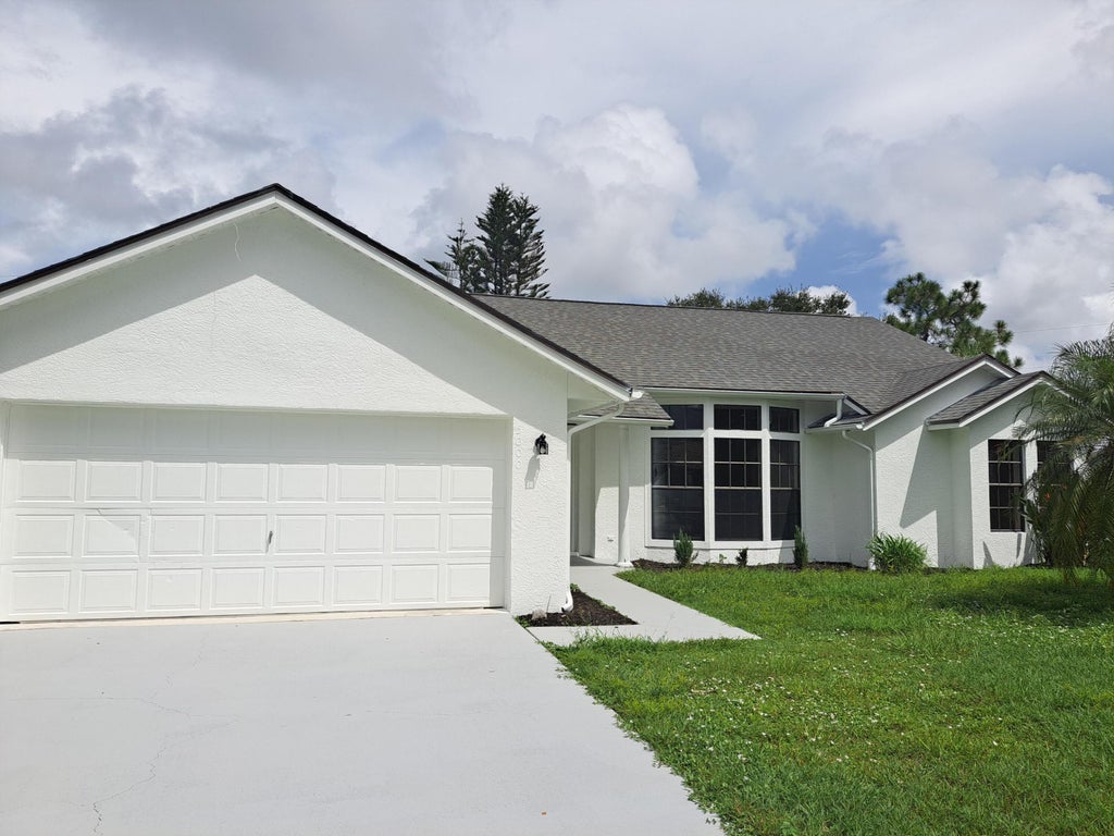 Photo of 5000 NW Erskin Terrace, Port Saint Lucie, FL 34983 (MLS # B26066690)