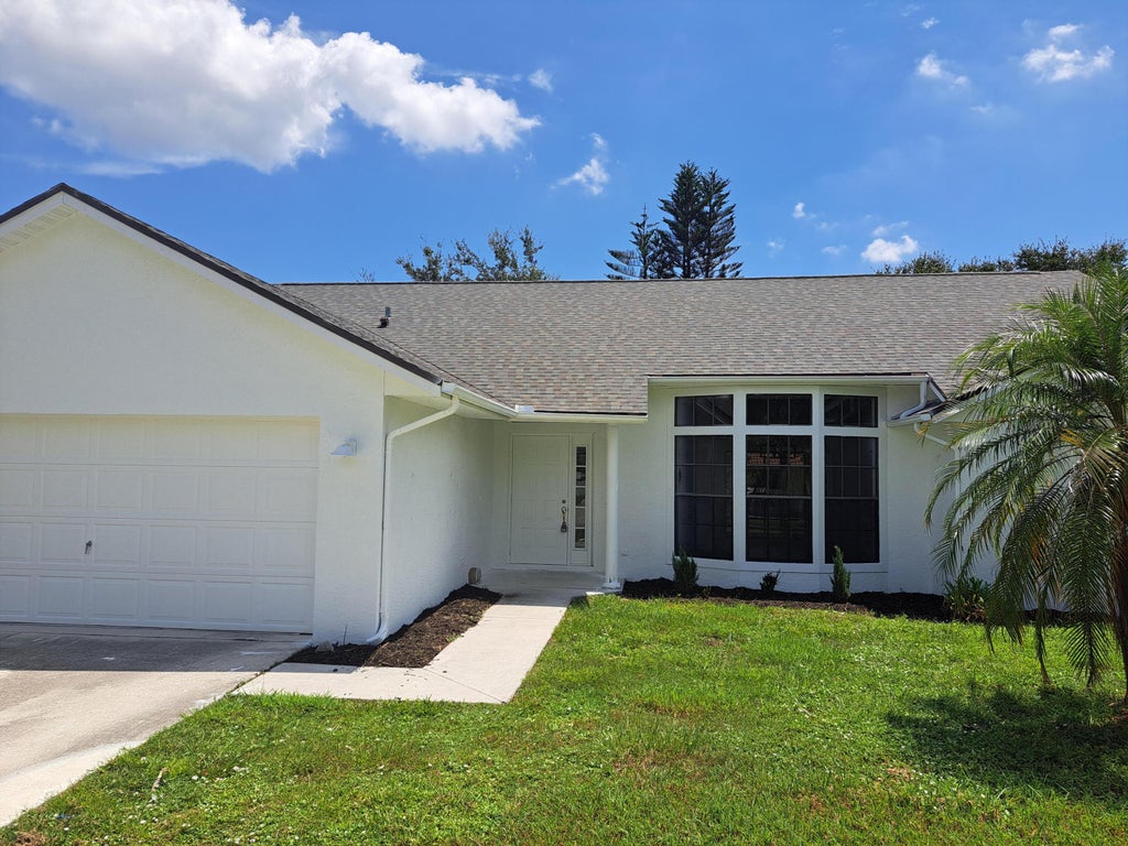 Photo of 5000 NW Erskin Terrace, Port Saint Lucie, FL 34983 (MLS # B26066690)