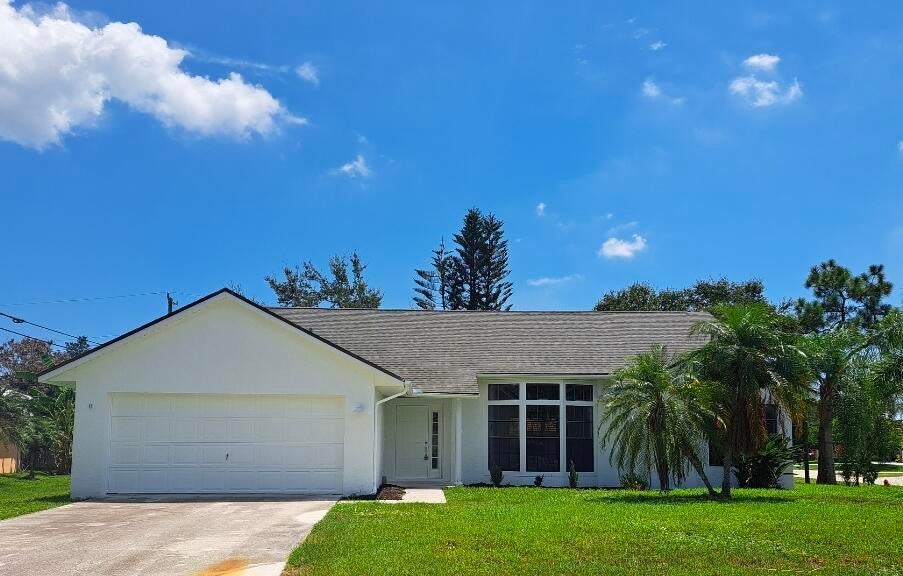 Photo of 5000 NW Erskin Terrace, Port Saint Lucie, FL 34983 (MLS # B26066690)