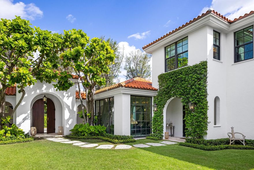 Completely reimagined 6BR/7.1BA estate with beautiful designer finishes throughout. This stunning Courtyard home is located on the highly desirable Wells Road on the Sunny South Side of the street offering an abundance of natural light. Situated on an oversized lot, the home was beautifully renovated in 2024. The welcoming front entry opens to a breathtaking and serene courtyard that feels like your own private oasis complete with beautiful, updated landscaping, covered dining loggia, and large swimming pool. Charming stone path leads to the inviting entry foyer with marble slab flooring. The interiors feature soaring 15' ceilings in most rooms, stunning flooring, and Crestron lighting and sound systems. Elegant formal dining room with built in buffet and China cabinets and gorgeous