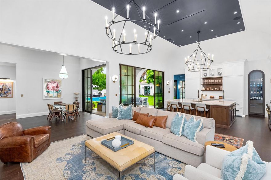 Completely reimagined 6BR/7.1BA estate with beautiful designer finishes throughout. This stunning Courtyard home is located on the highly desirable Wells Road on the Sunny South Side of the street offering an abundance of natural light. Situated on an oversized lot, the home was beautifully renovated in 2024. The welcoming front entry opens to a breathtaking and serene courtyard that feels like your own private oasis complete with beautiful, updated landscaping, covered dining loggia, and large swimming pool. Charming stone path leads to the inviting entry foyer with marble slab flooring. The interiors feature soaring 15' ceilings in most rooms, stunning flooring, and Crestron lighting and sound systems. Elegant formal dining room with built in buffet and China cabinets and gorgeous