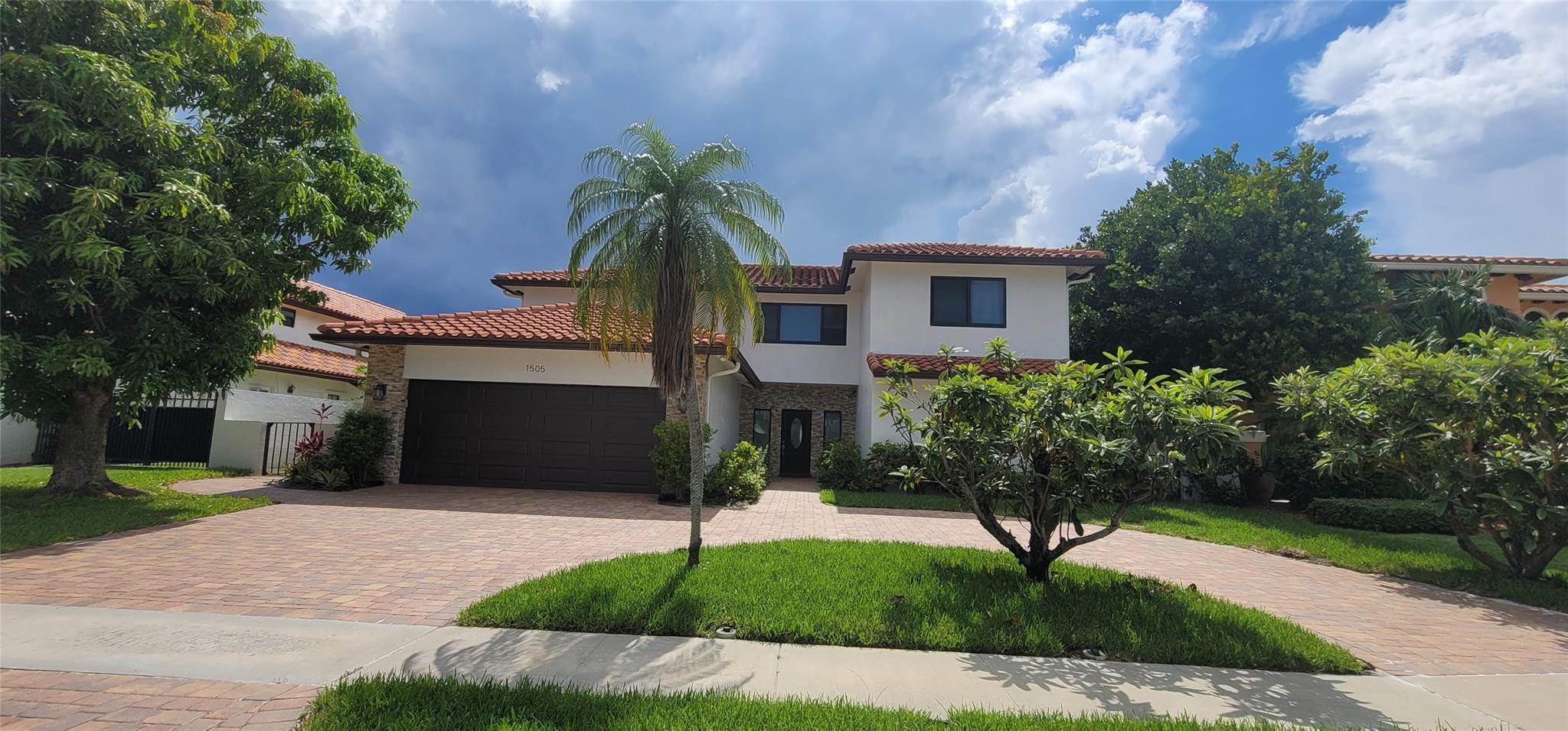 Welcome to this charming home nestled in the desirable East Boca renowned for its top-rated district and family-friendly community. One of the notable aspects of this home is its location on a quiet cul-de-sac street. This waterfront home has 76 feet of waterfrontage and ocean access with a spacious dock with a lift for your boat. The spacious living area ensures ample room for family and guests. The large kitchen with SS appliances offers a functional space for culinary enthusiasts. The house has hurricane-impact windows and doors. With 4 spacious bedrooms and 4.5 bathrooms. The pool features a new marble deck, and the pool has been renovated. For best a/c performance, foam insulation was applied under the roof.