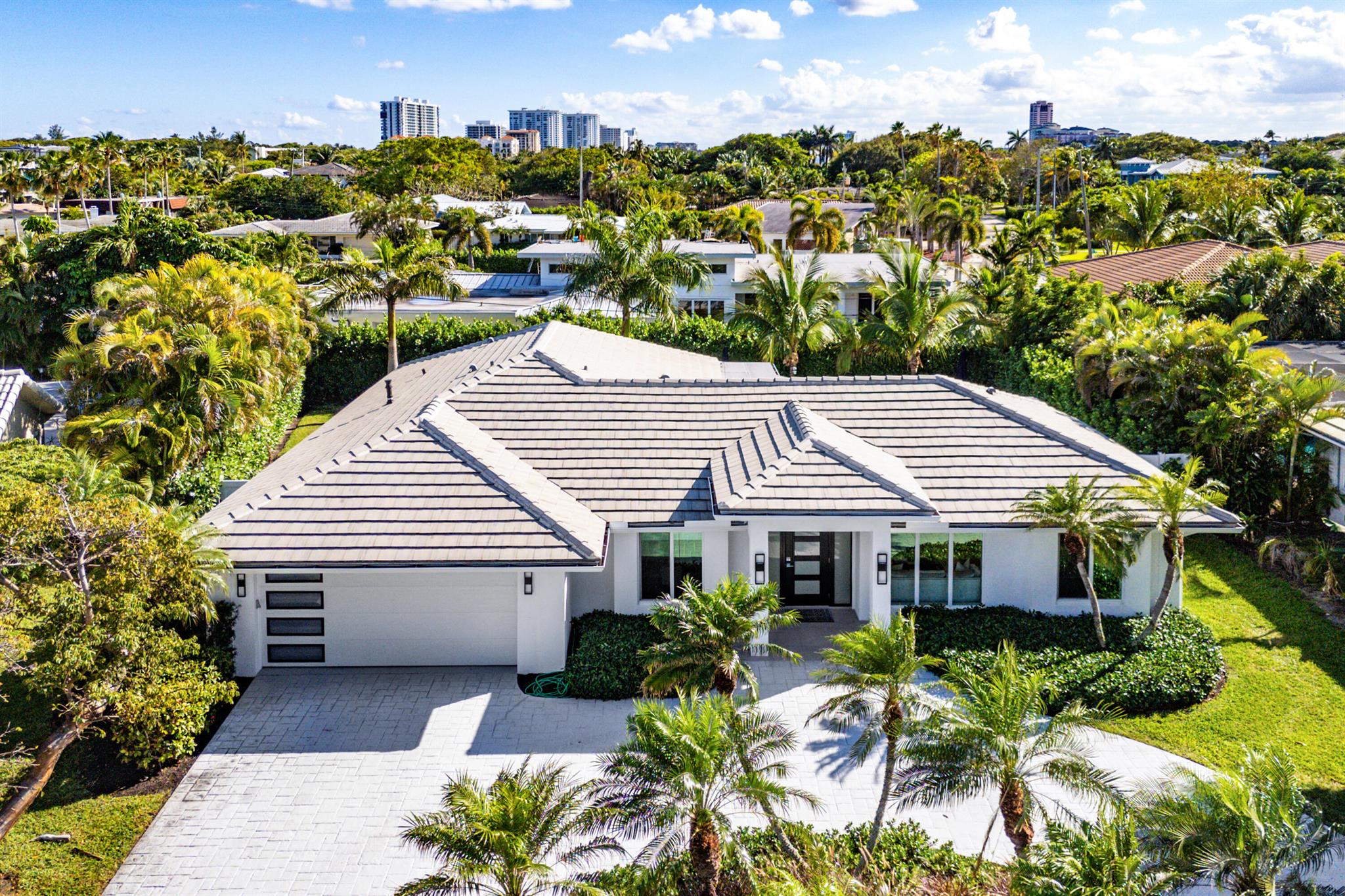 Welcome to Sun and Surf, one of Boca Raton's most coveted coastal communities. Just across A1A from the beach and adjacent to Red Reef Golf Course, this family-friendly enclave offers the perfect combination of walkability, tranquility, and luxury living.This residence was fully renovated down to the studs in 2023, including a brand-new roof, ensuring every system, surface, and finish has been thoughtfully modernized for today's lifestyle. Inside, a breathtaking open-concept design showcases a chef's kitchen with custom cabinetry, designer finishes, and expansive prep space that flows seamlessly into the dining and living areas The home features four spacious bedrooms, while each bath is finished with custom designer tile work for a spa-like feel.