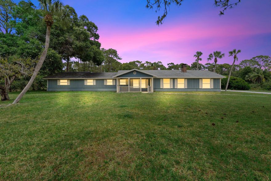 Welcome to your own little slice of Palm City Farms paradise. Tucked away on one of the most sought-after streets in Palm City Farms, this 9.5-acre property has all the charm and space you've been looking for. You've got two ponds, tons of privacy, and so much potential to make it your own. The main house is a ranch-style 3 bed, 3 bath with plenty of space to spread out. It's got a cozy brick fireplace, a good-sized kitchen, and a huge covered patio out back that's perfect for morning coffee or weekend BBQs. The guest house is a total bonus--1 bed, 1 bath with an open floor plan, full kitchen, tile floors throughout, and views of the pool and gazebo that give you all the vacation vibes.