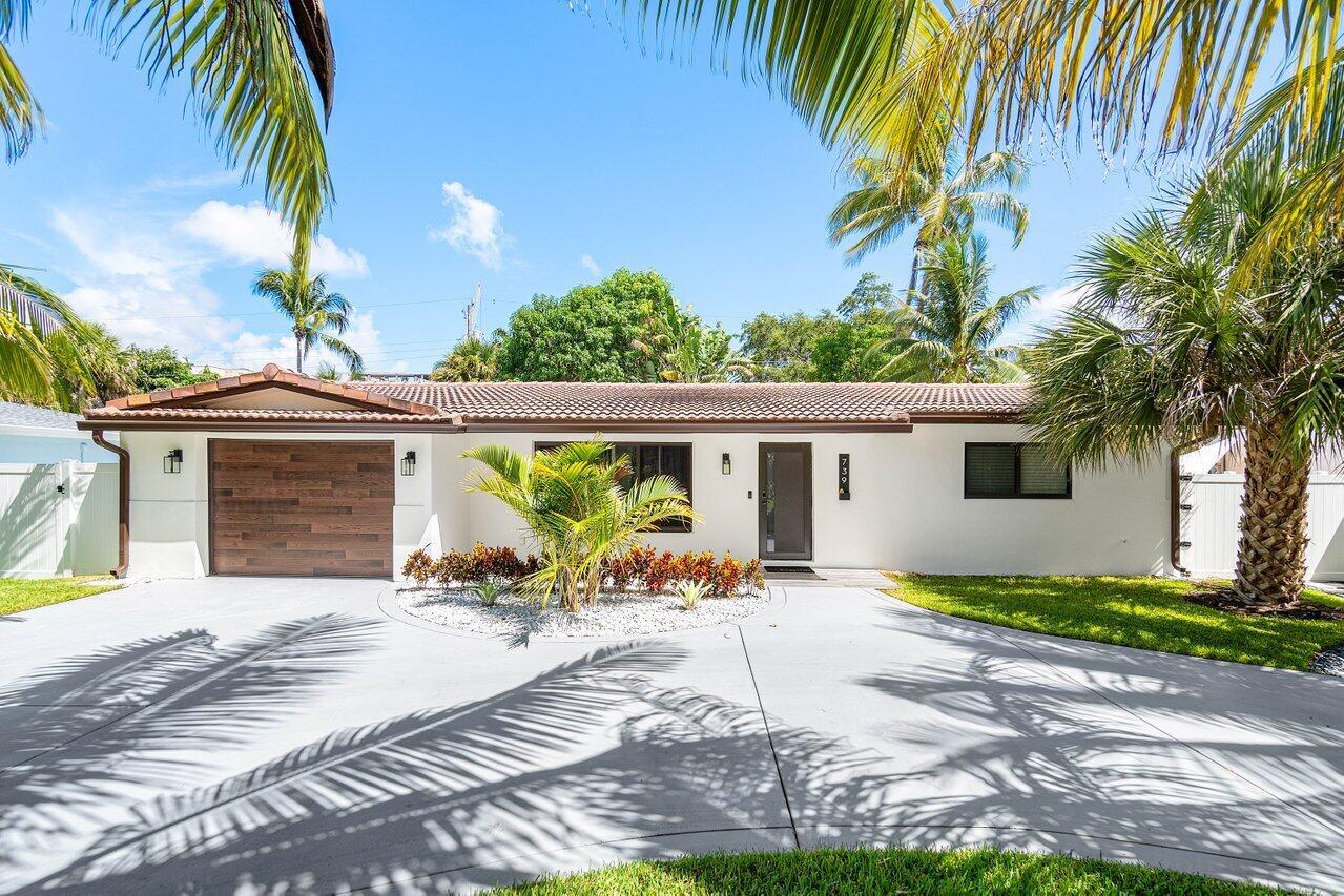 Welcome to 739 NW 7th St, a completely renovated modern and furnished home with no expense spared! Open concept living with exposed wood trusses and duct work gives a modern industrial vibe, matte porcelain kitchen countertops and all new stainless steel appliances as well as custom designed bathrooms and closets. Flooded with natural light in every room. A hidden doorway leads to the garage and laundry room featuring epoxy floors and additional storage and custom cabinets throughout. The backyard oasis features a newly resurfaced pool and pavers, pergola with BBQ area and lush landscaping with several fruit trees for your enjoyment. This home is 1 mile from downtown Boca Raton's hub of restaurants and shopping and also less than 1 mile from the newly constructed Brightline station.
