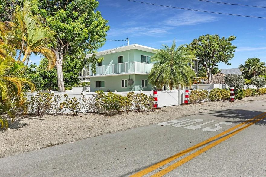 FOR RENT this 3/3 on the canal. Enjoy impact doors and windows, a brand-new AC system, a refreshed kitchen with stainless steel appliances, and a washer/dryer. The spacious laundry/storage room is a bonus. Outside, you'll find 34 feet of concrete dock with a 10,000 lb lift, fully fenced. Separate storage building and a massive Tikihut, perfect for outdoor entertaining! The covered patio is ideal for gatherings as well. Inside, the home features floating laminate flooring throughout, and there’s a screened-in balcony on the upper level and a walk-around balcony. Community boat ramp. Centrally located on Plantation Key, this home is close to shopping, dining, schools, medical care, recreation, Founders Park, marinas, and fishing and diving charters. Make it home!