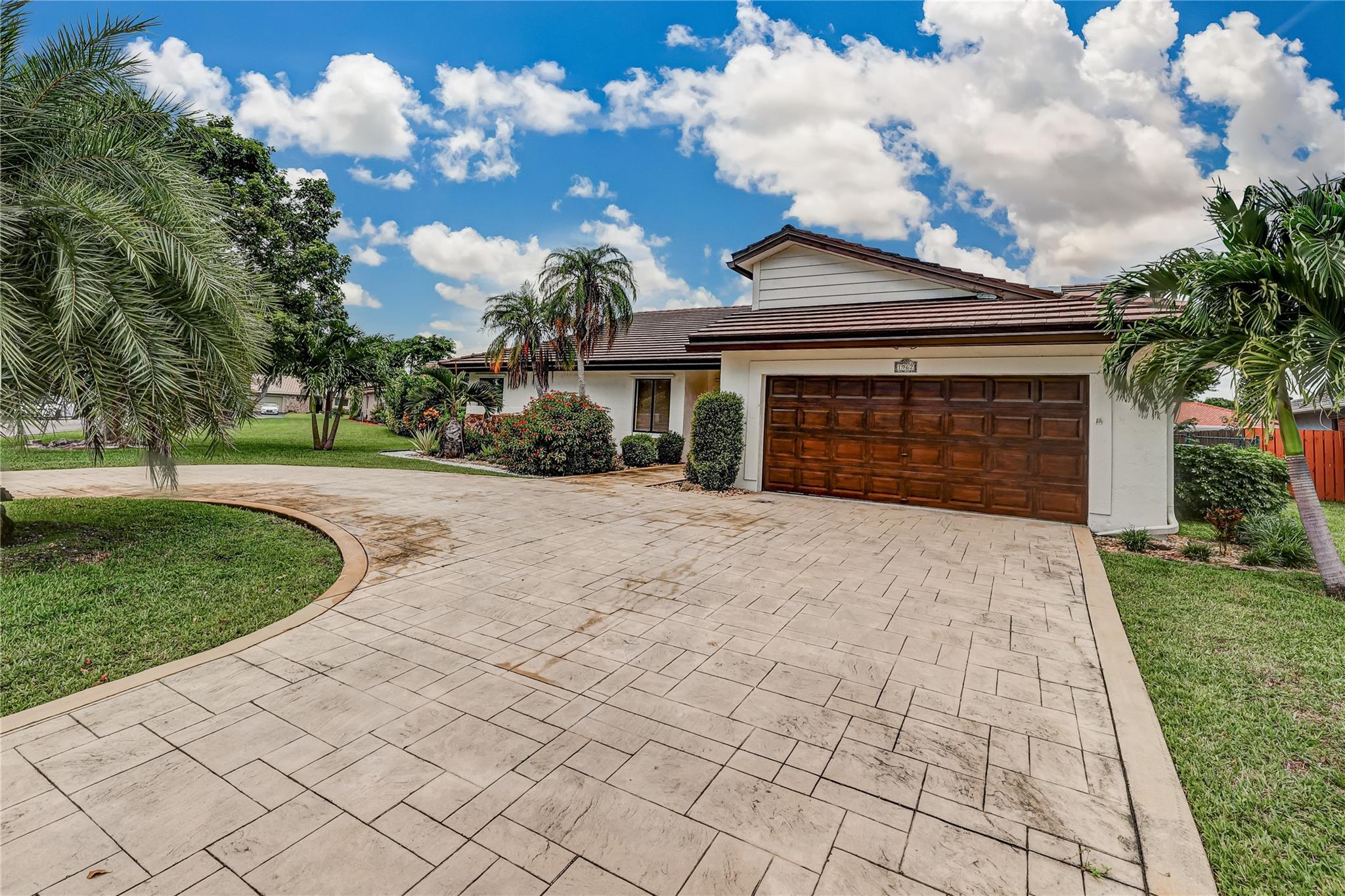 Over $70,000 in recent upgrades: brand new circular driveway, full exterior paint (house, roof, garage door, and fence), roof maintenance, and resurfaced pool tiles. Beautifully maintained 4-bedroom pool home in desirable Cypress Run. Open floor plan, and high ceilings. Priced at $795K, well below replacement cost given improvements. Features large vaulted smooth ceilings upon entering with tile and wood-like vinyl flooring throughout. Custom kitchen with Corian countertops for durability and repairability, an island for extra workspace for food prep, and S.S. appliances. Exterior features Clusia hedges for privacy, providing a striking visual element. Extended patio surrounding the pool with travertine tile! The roof was replaced in 2009.